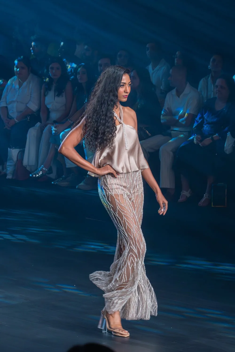 Taupe halter top with intricately embroidered flared pants.